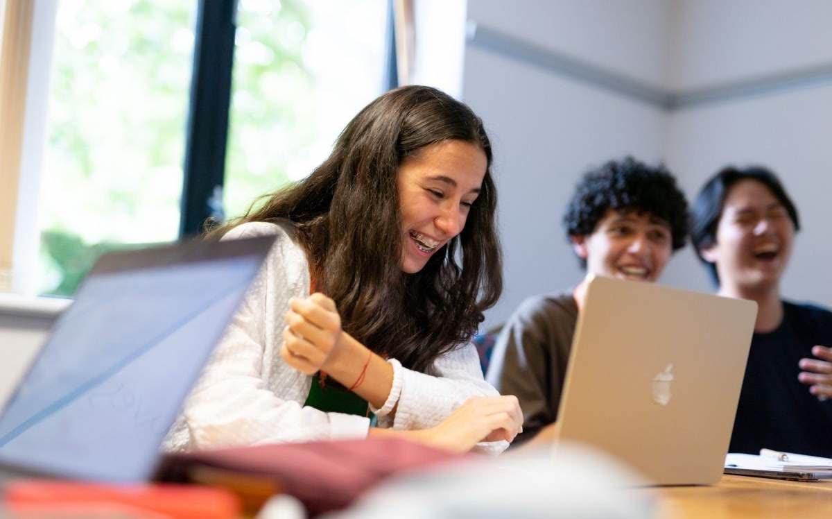 Students in a seminar with laptops